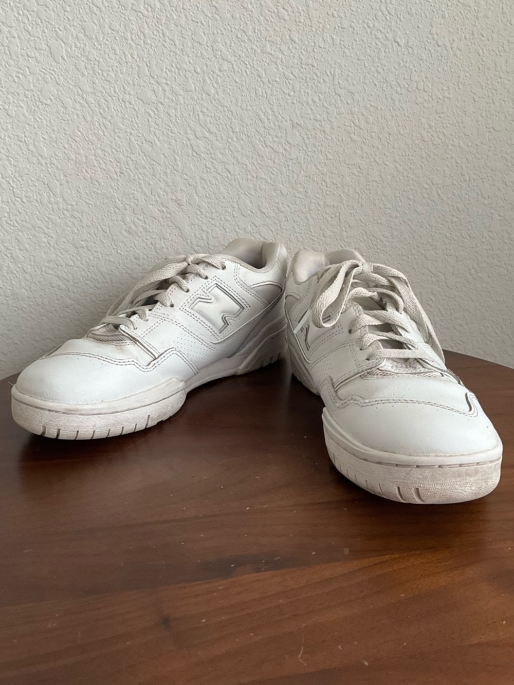 New Balance 550 sneakers in the white colorway.